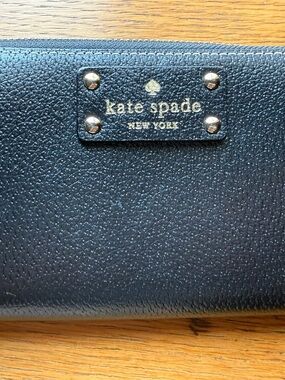 kate spade Black Pebbled Leather Zip Wallet with Gold Logo Plate
